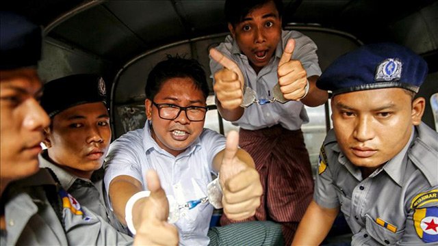 Myanmar slaps prison sentences on 2 Reuters journalists